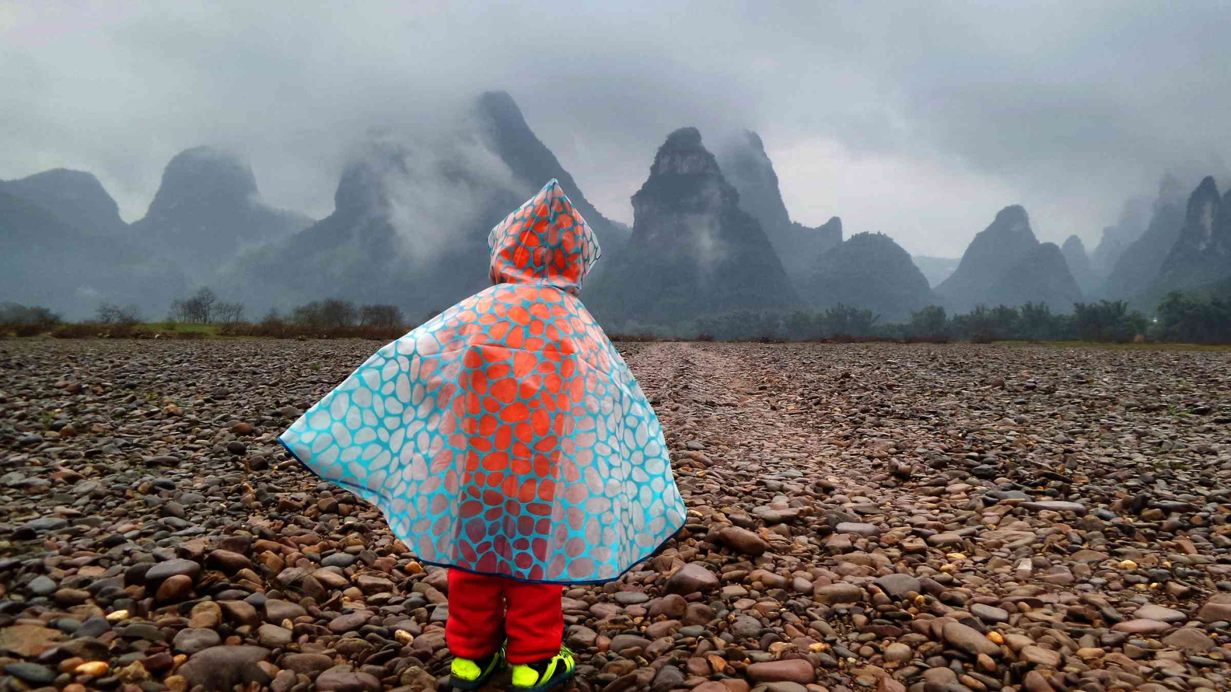 Child watching mountains