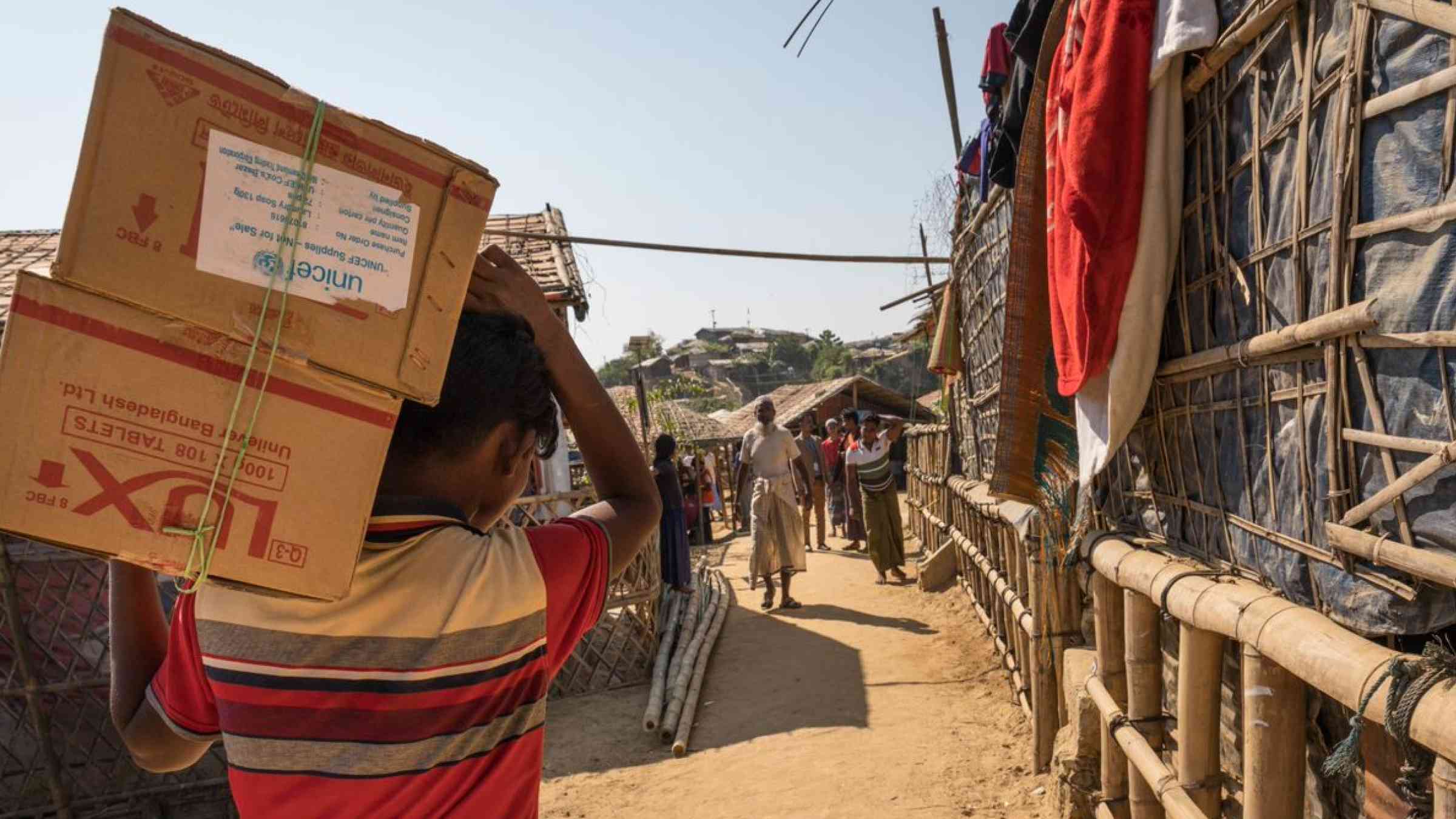 A person carries a box in Bangladesh