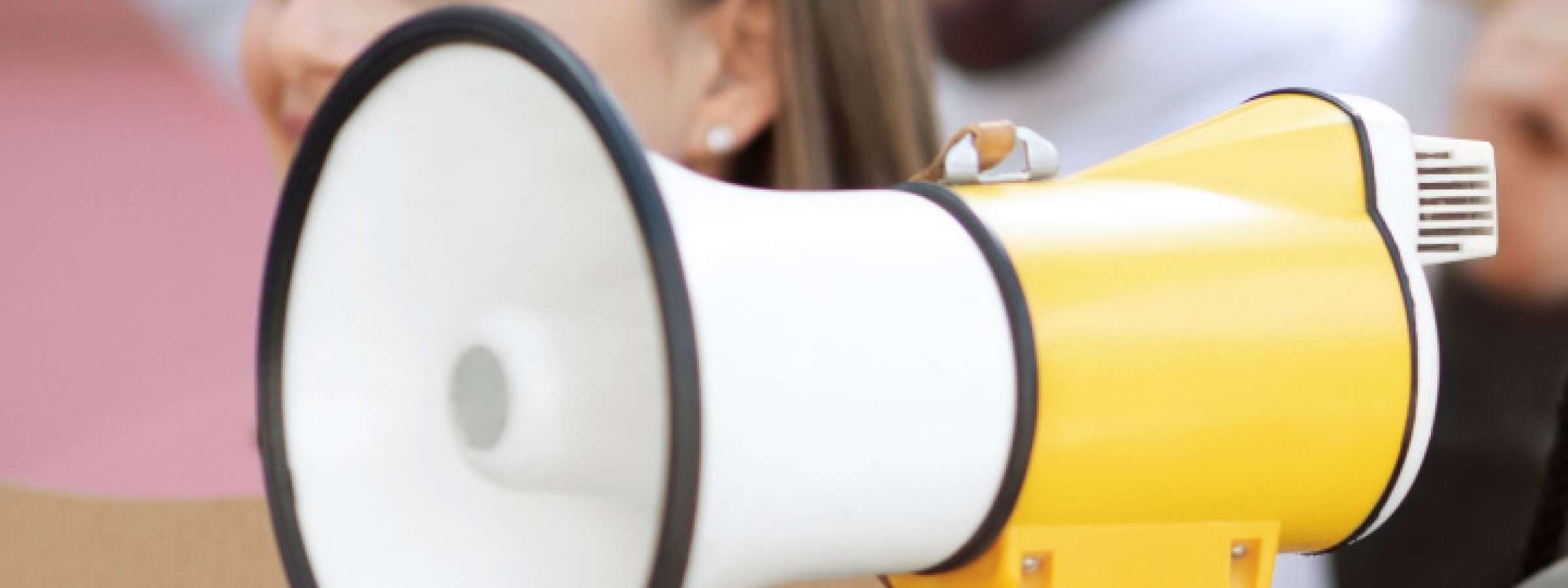 Cheerful young black lady leading international group of protestors