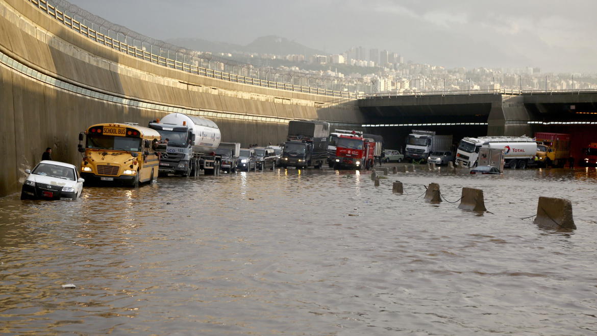 Vehicles are stuck in flooded highway in Beirut.