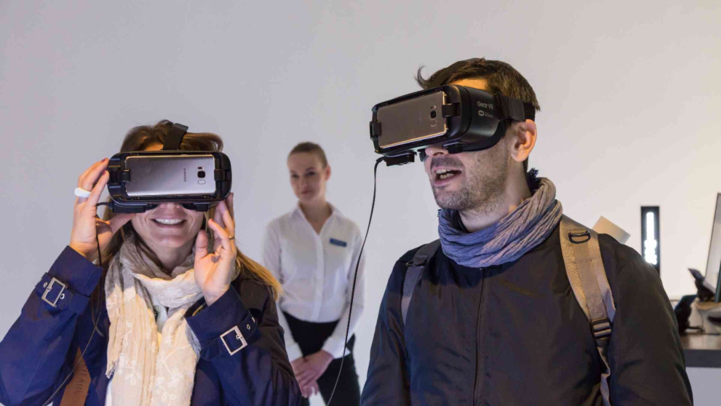 Couple with virtual reality headset